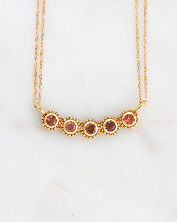 gold life necklace, sunstones, sapphires