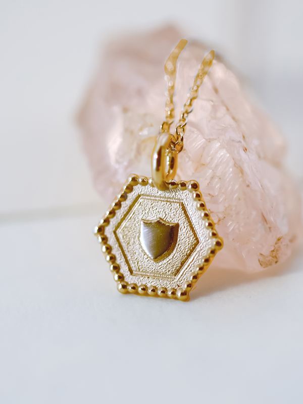 gold shield charm necklace